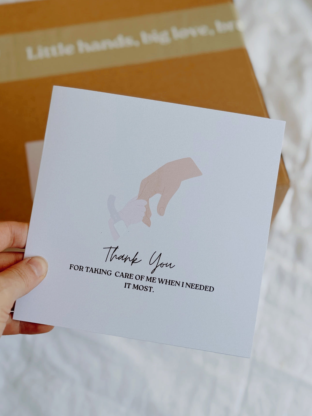 hand holding card of thank you note for doctors and nicu nurses which says, thank you for taking care of me when I needed it most.
